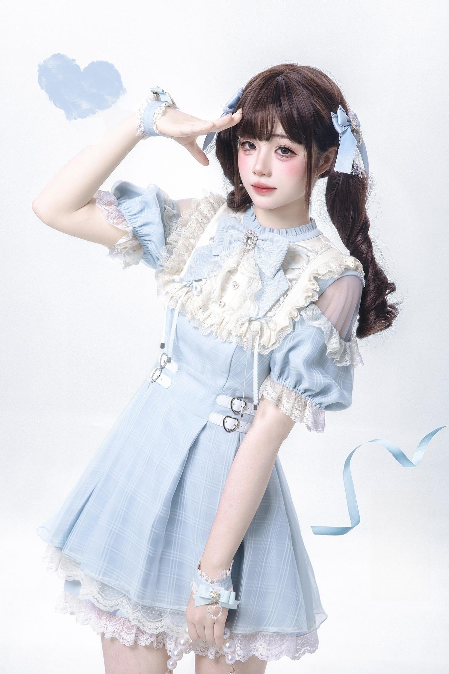 Water blue Jirai Kei dress close-up front detail of large lace collar bow tie sheer puff sleeves and decorative white rhinestone buckles on waist