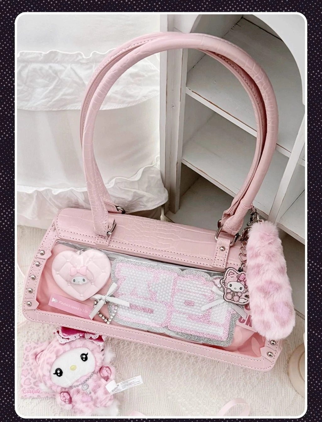Multiple color variations of bat croc Jirai Kei itabag displayed together showing pink white and black options with different chain accessories