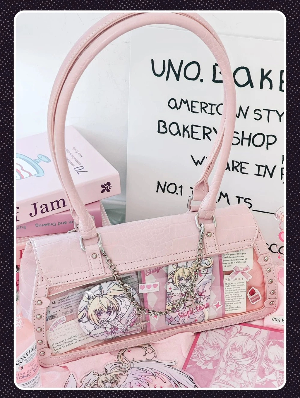 Bat-inspired croc itabag product main angle showing detachable star chain strap clear window display and premium PU leather texture detail