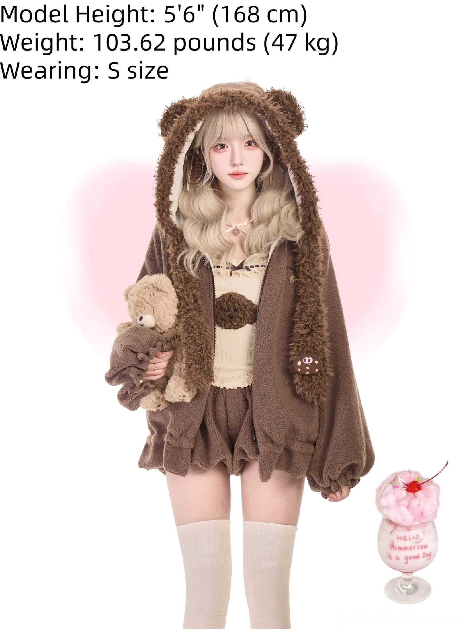 Blonde lolita model in oversized brown bear ear fleece coat with cream camisole underneath holding small teddy bear plush toy for cute aesthetic photography