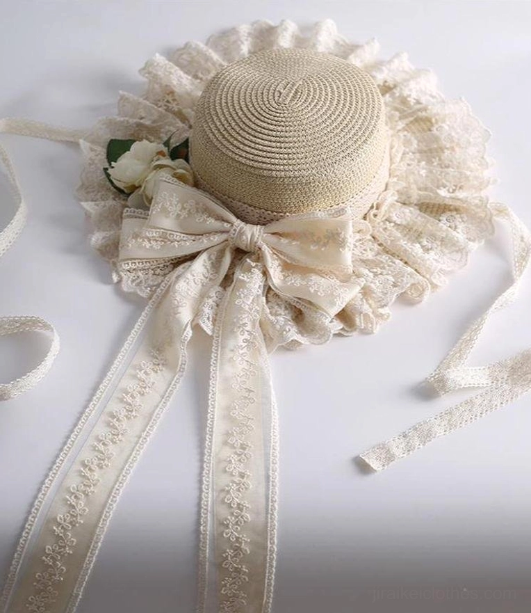 Beige country lolita straw sunhat flat lay front view on white background with wide lace brim large satin bow and patterned ribbon sashes