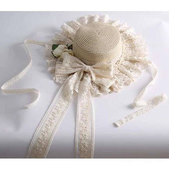 Beige country lolita straw sunhat flat lay right side view showing woven straw crown ruffled lace edge and big bow with embroidered ribbons