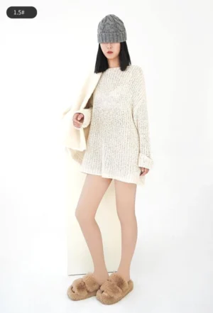 Full-body standing shot of model wearing beige velvet tights with knit dress, black beanie and coat - studio white background demonstrating daily wear versatility