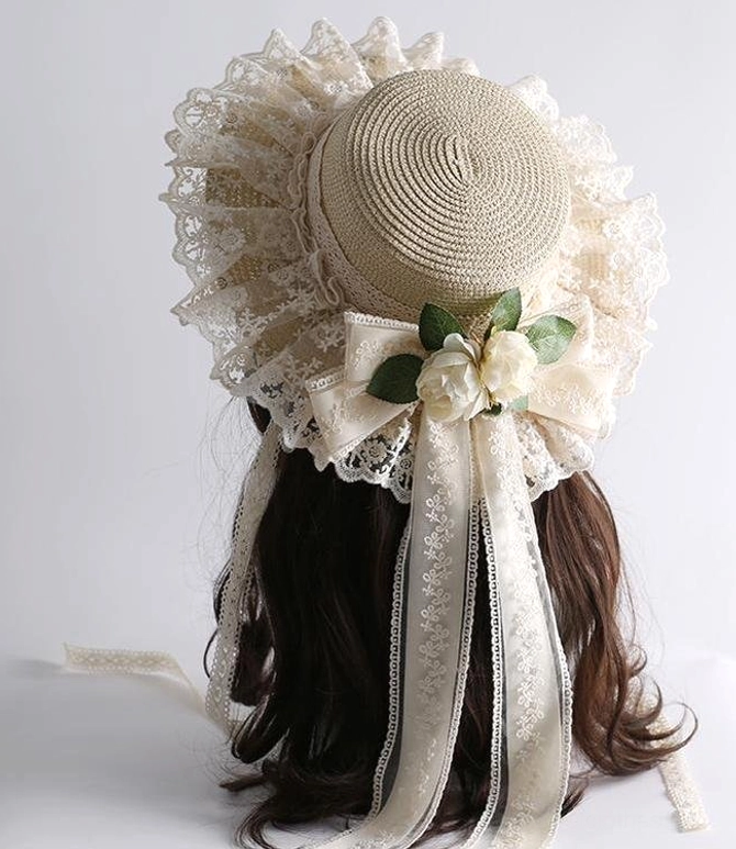 Beige country lolita straw sunhat left side back perspective displaying lace frilled brim and large bow with long ribbon sashes jirai kei