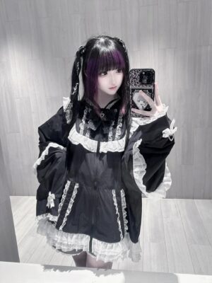 Black Jirai Kei cat-ear lace sun jacket with white lace trims and ruffled hem worn by gothic model in mirror selfie