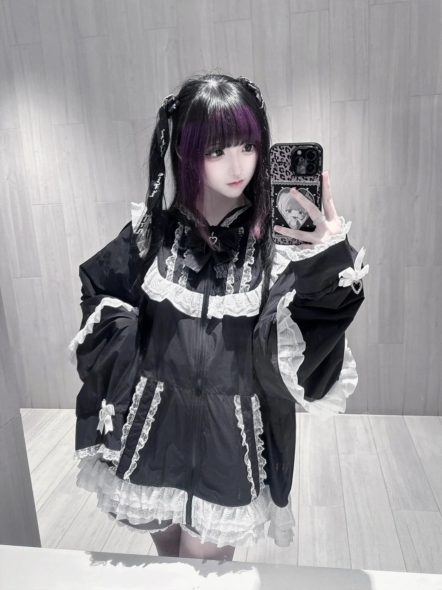 Black Jirai Kei cat-ear lace sun jacket with white lace trims and ruffled hem worn by gothic model in mirror selfie