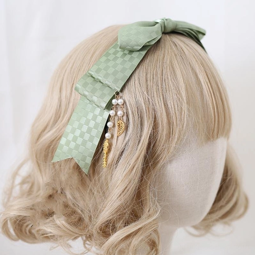 Bird-cage themed matcha green Jirai Kei hair clasp with intricate cage motif metalwork, embodying the philosophical duality of Jirai Kei aesthetic freedom and constraint