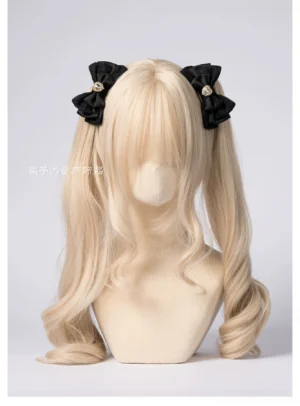 Black satin layered bow hair clips with heart rhinestone on blonde mannequin twin tails Jirai Kei fashion styling demonstration