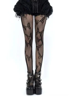 Black butterfly fishnet pantyhose front full leg view Jirai Kei gothic aesthetic worn with ruffled black skirt and platform boots