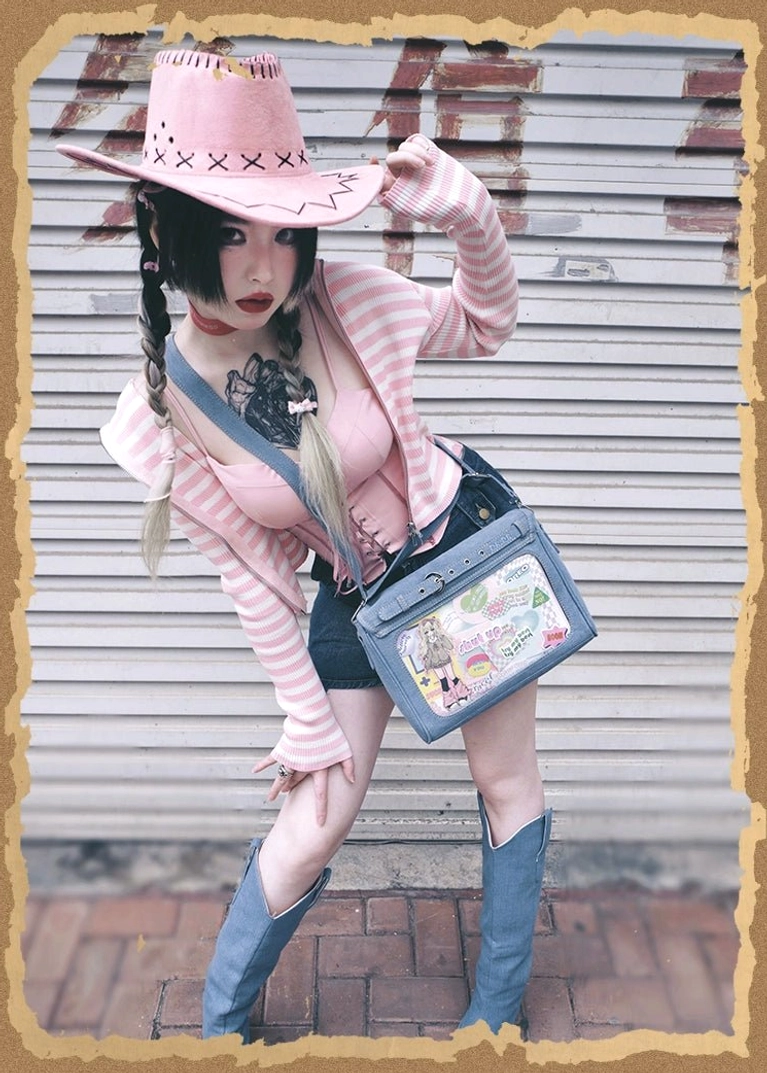 Black denim Jirai Kei itabag crossbody handbag detail shot of decorative hardware, leather fasteners, and patchwork design elements with durable construction