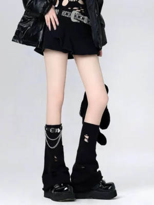 Black ripped knit flared leg warmers side-front view showcasing distressed details and punk street style pairing
