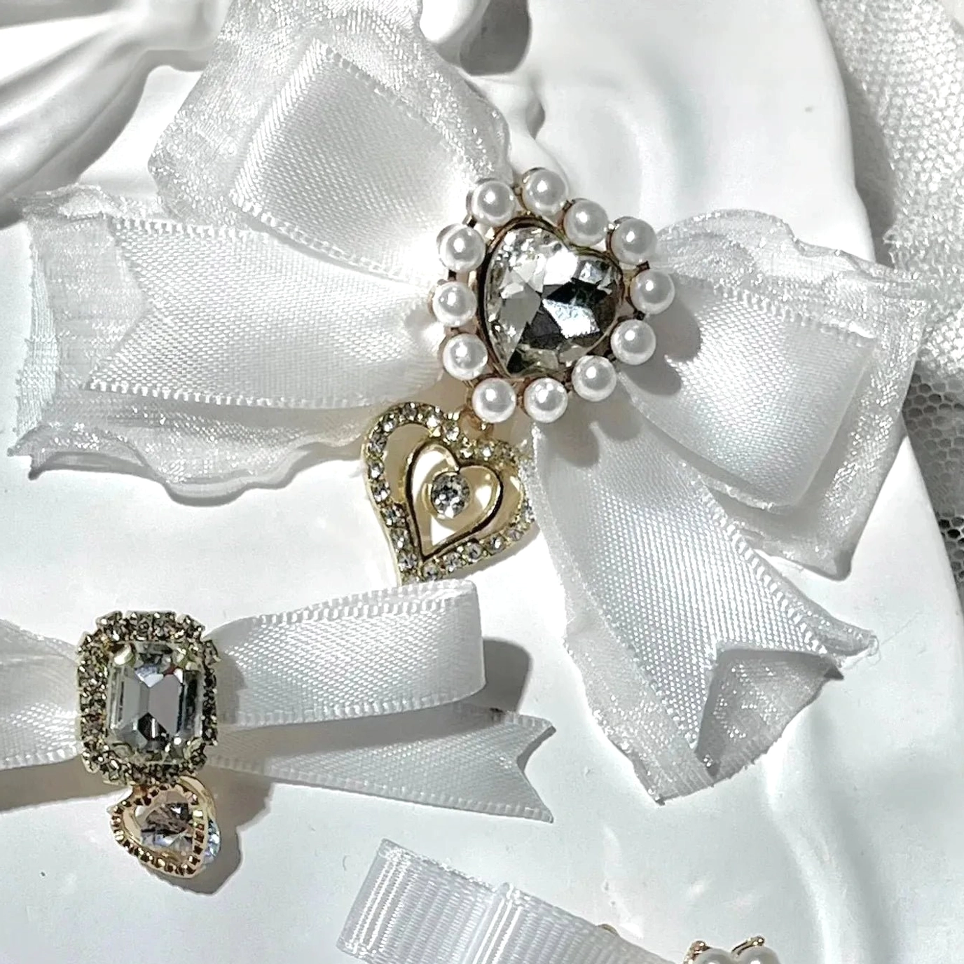 Double-layer Jirai Kei bow hair clips in black with dimensional layered design rhinestone and pearl accent decoration