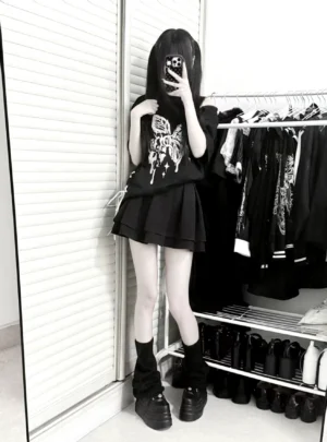 Black gothic butterfly print oversized t-shirt full body mirror shot paired with pleated skirt and platform boots alternative fashion styling