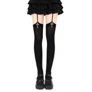 Black Gothic cross pendant Jirai Kei garter thigh-high stockings with silver cross charms shown on model wearing ruffle skirt and platform loafers front view