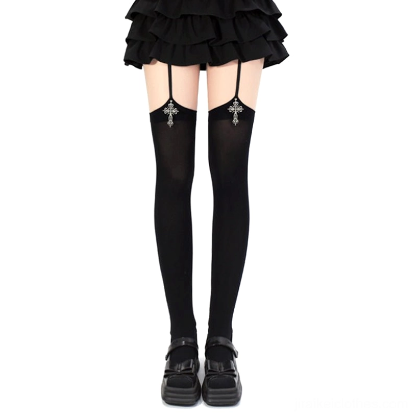 Black Gothic cross pendant Jirai Kei garter thigh-high stockings with silver cross charms shown on model wearing ruffle skirt and platform loafers front view