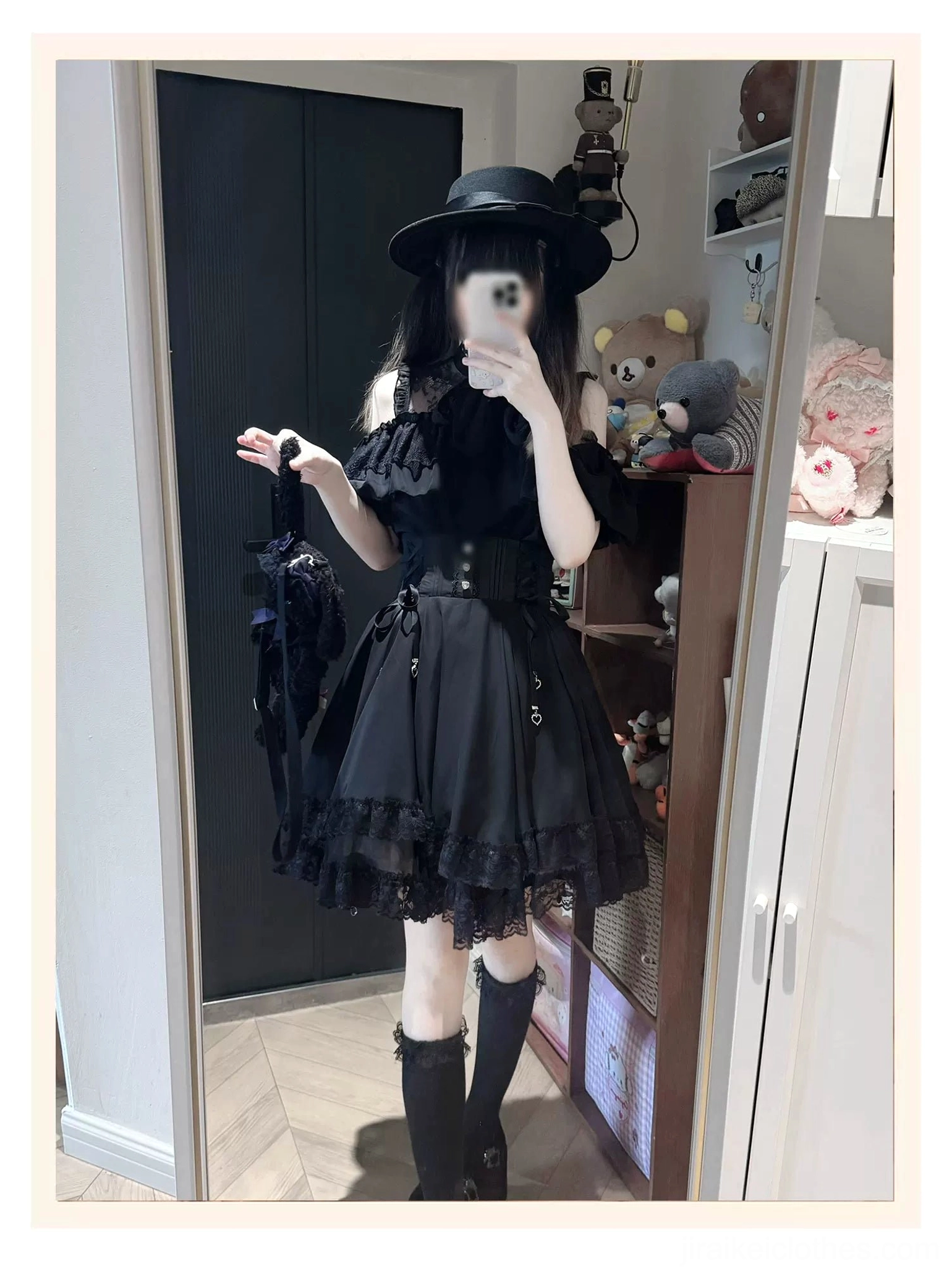 Black off-shoulder gothic Jirai Kei dress with black handbag top hat knee-high boots complete styling