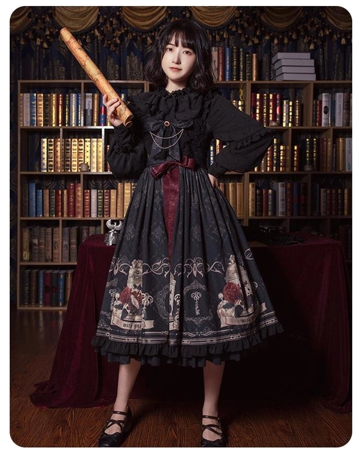 Black gothic lolita dress with birdcage print full body front view indoor vintage library setting