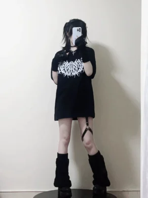 Black oversized gothic print cotton t-shirt jirai kei street style worn by female model size L with leg straps platform boots and gloves front view