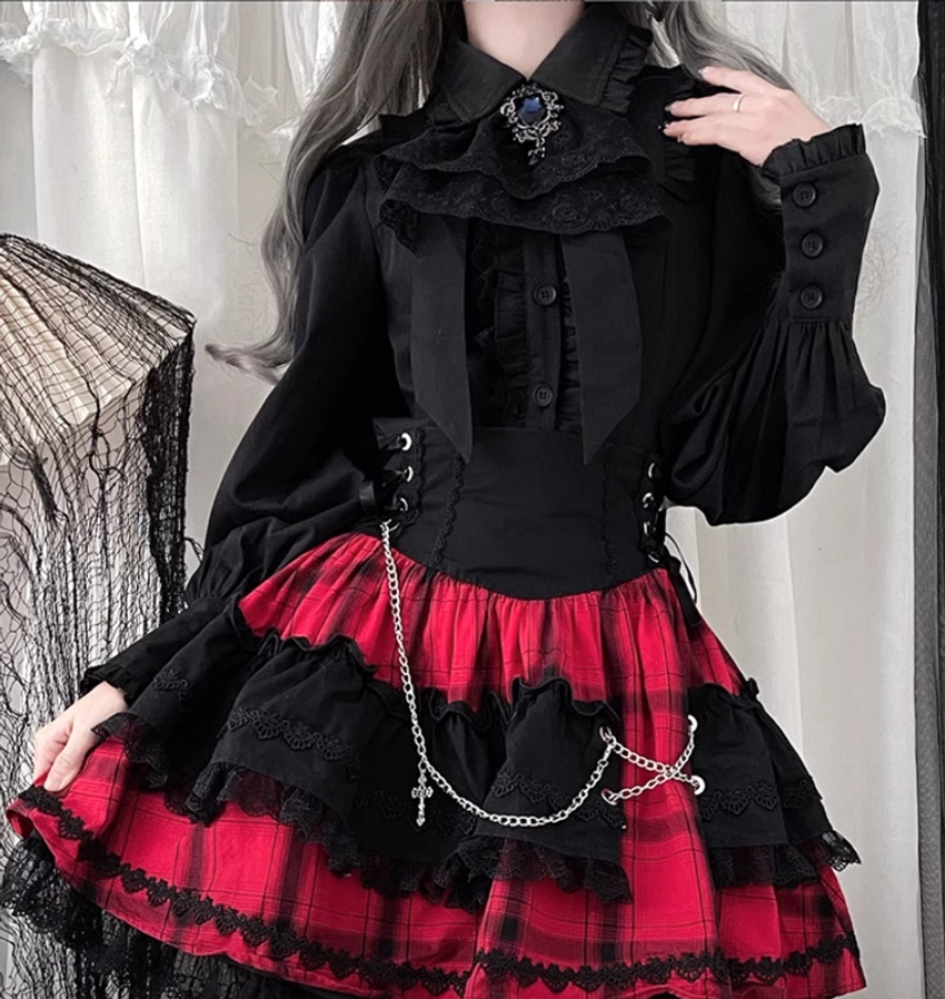 Black old version Jirai Kei blouse with puff sleeves gem brooch and layered plaid skirt front