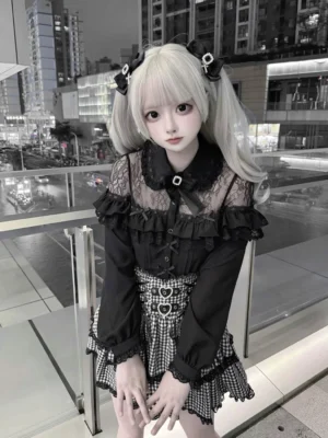 Black lace Jirai Kei blouse with Peter Pan collar and open shoulder design, worn with gingham skirt and twin-tail hair clips, front full-body view