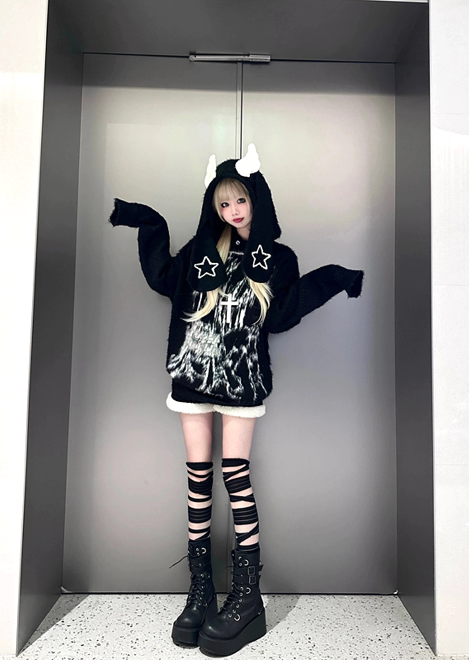 Black bunny ear hooded sweater full body front view jirai kei aesthetic with horn ear hood star embroidery striped socks combat boots