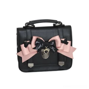 Black Jirai Kei Cambridge handbag with pink and black decorative bow featuring letter print detail and metal lock charm, flat lay product photography