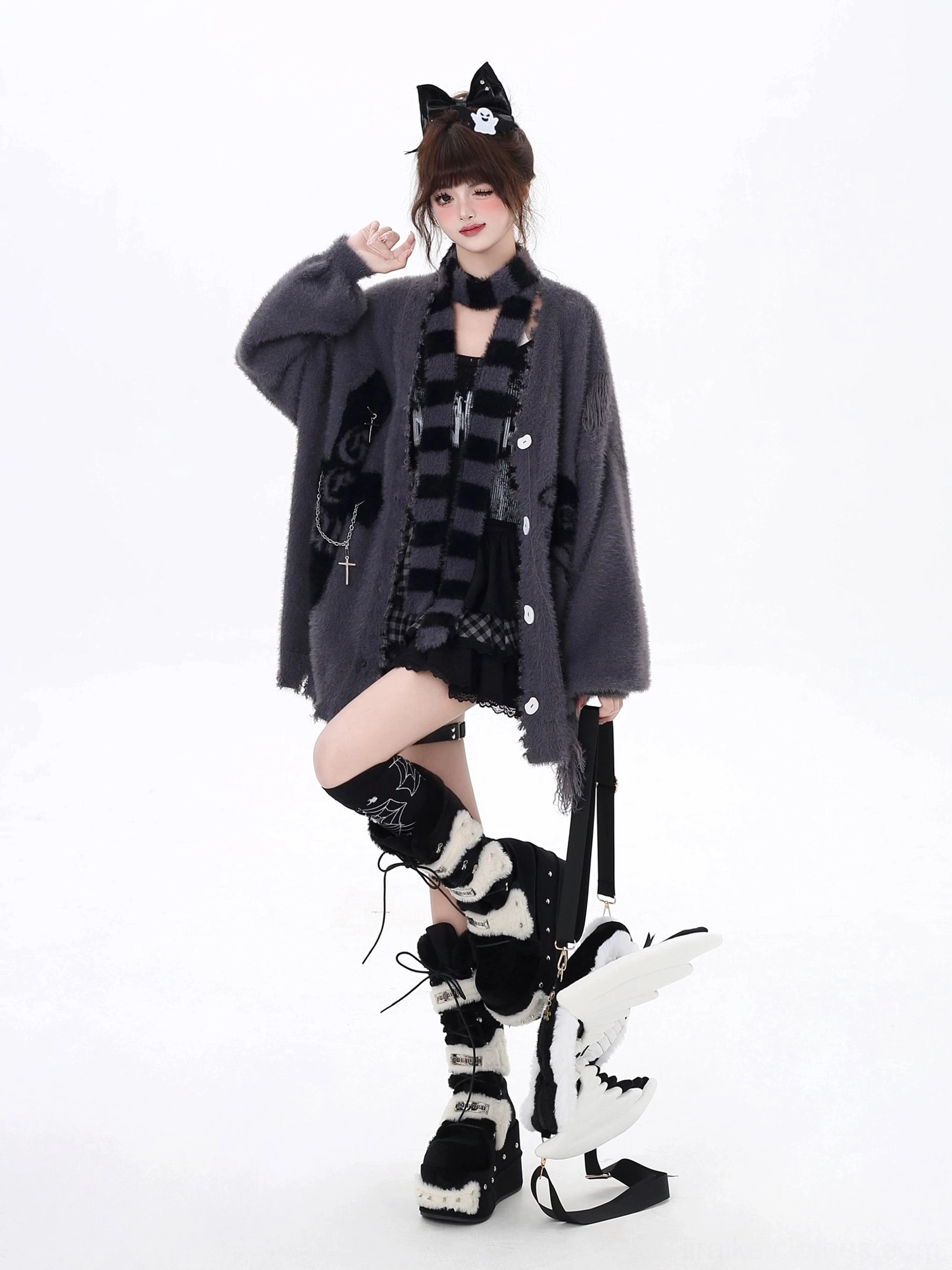Black Jirai Kei oversized cardigan button detailing and V-neck silhouette, showcasing button-up construction and relaxed fit of distressed cardigan style piece