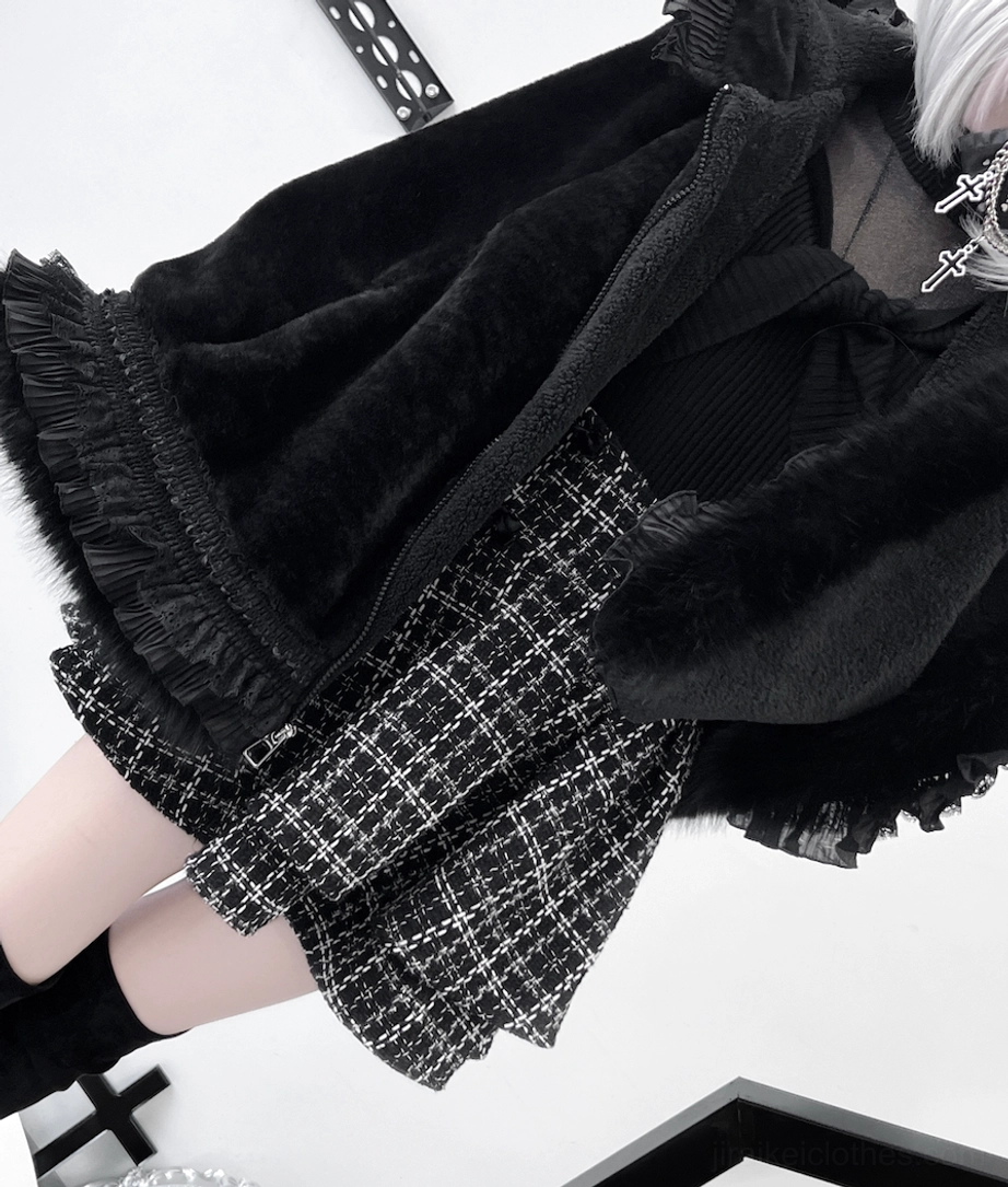 Back view of black cat ear fleece cape coat showing cape silhouette, hood design, ruffle hem, and overall dramatic drape construction