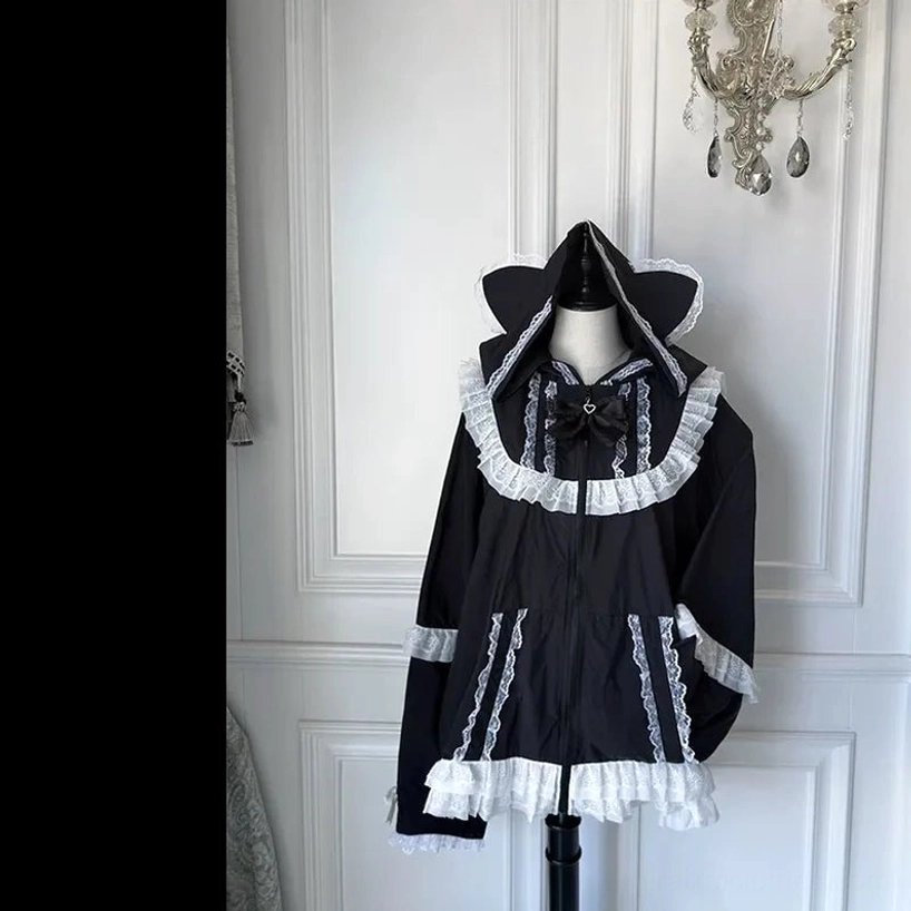 Black cat-ear sun jacket on mannequin front view with white lace stripe detail and bow collar accent