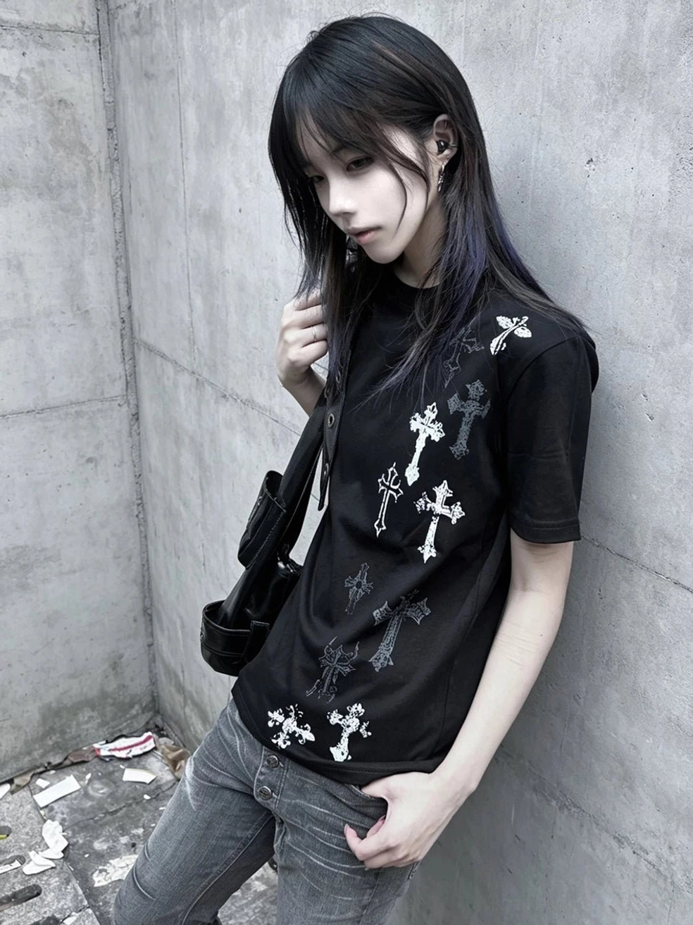 Black Jirai Kei cross print t-shirt detail shot showing front graphic print quality, structured shoulder construction, and crew neck design elements