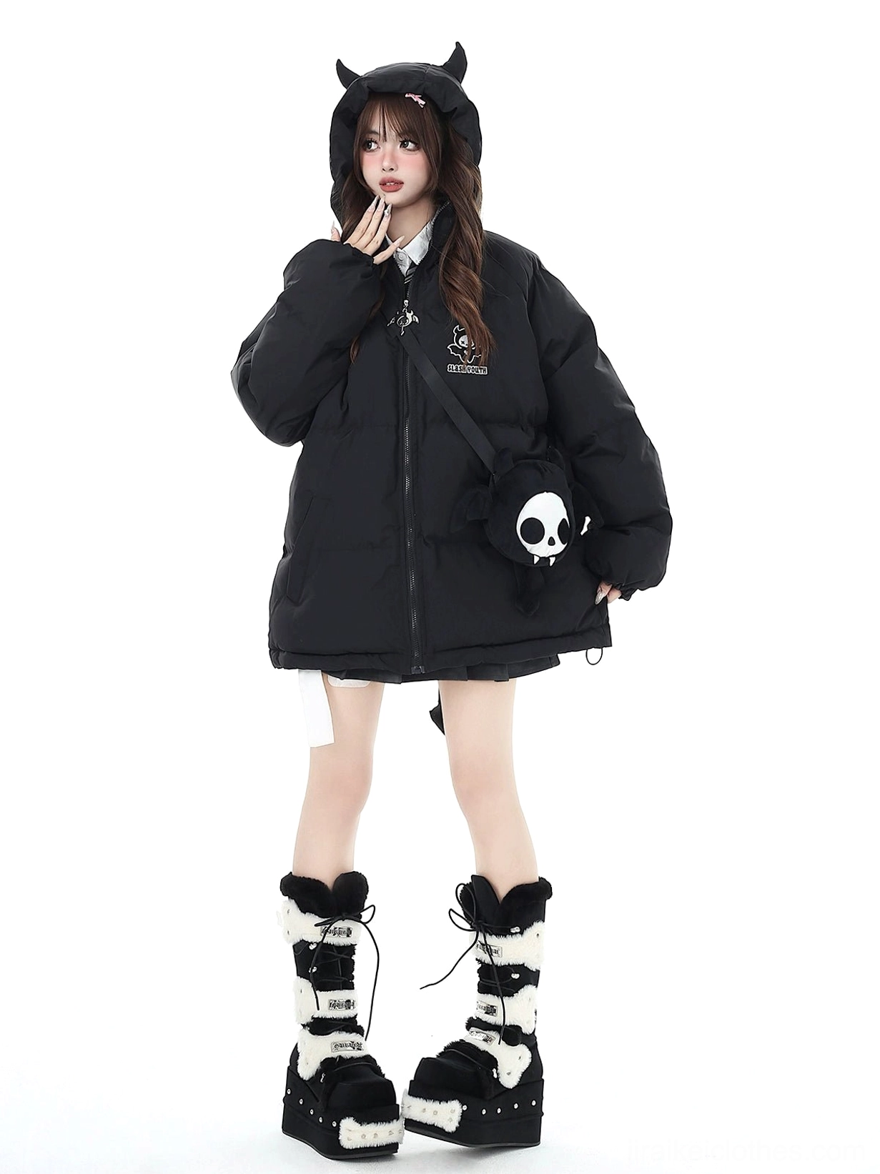 Black Jirai Kei devil horn oversized puffer coat full front view with detachable skull crossbody bag on model with long gothic hair