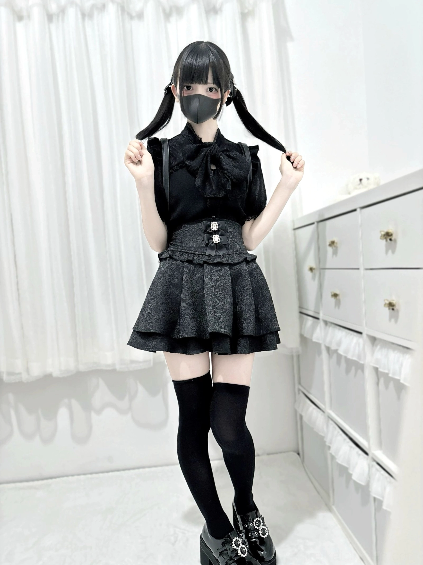 Black double-layer ruffled Jirai Kei skirt rear view full-body back shot flared hem jacquard texture
