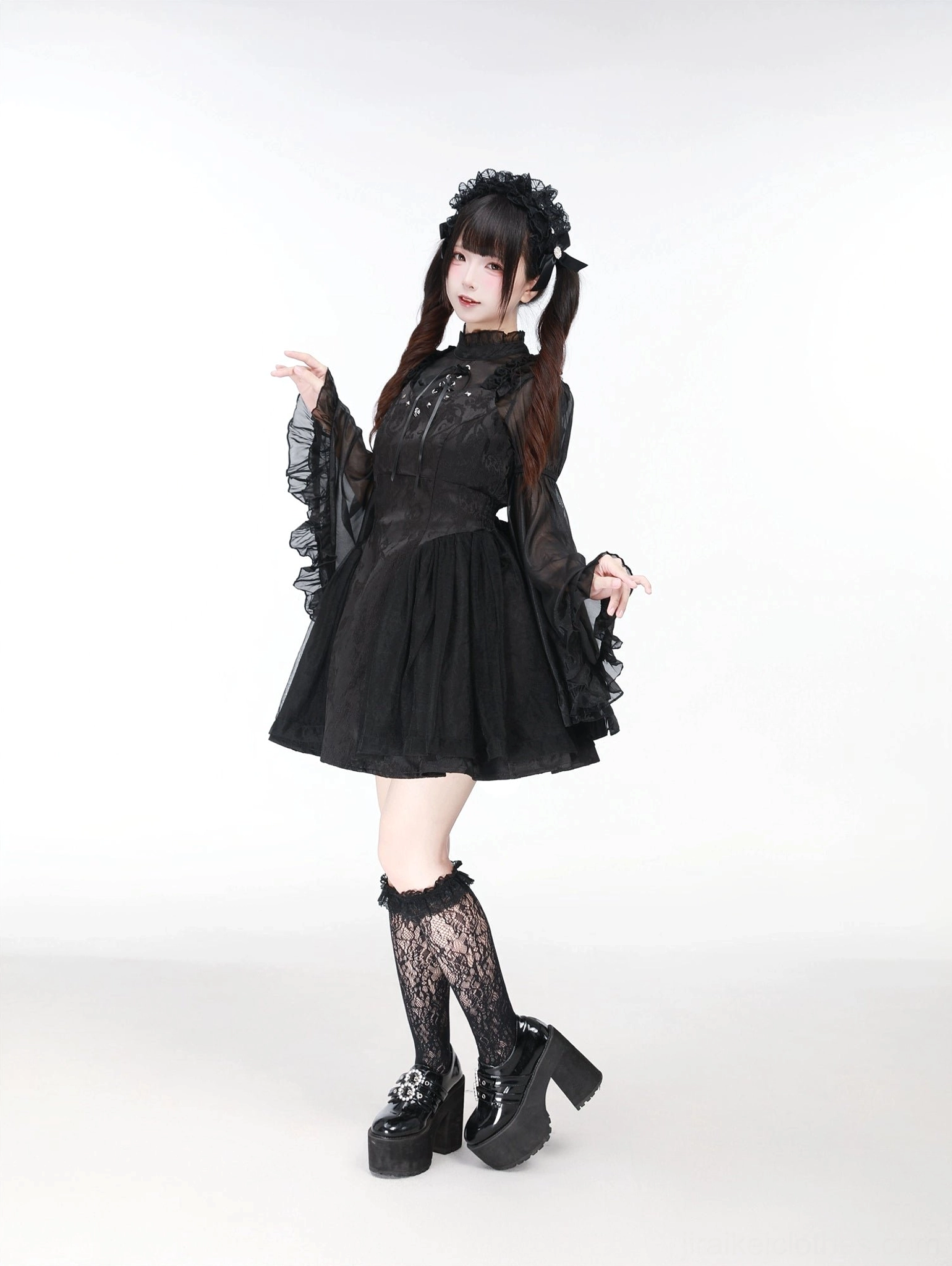 Black Jirai Kei ensemble three-quarter front angle showing fitted waist shirring and short A-line skirt construction