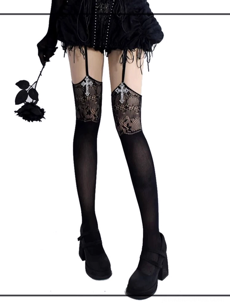 Black gothic jirai kei garter thigh-high stockings with cross pendant and floral lace cutout, front full leg display with feathered skirt and black rose prop