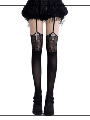 Black gothic jirai kei garter thigh-high stockings with silver cross pendant and floral lace cutout, front view paired with black feathered skirt and platform shoes