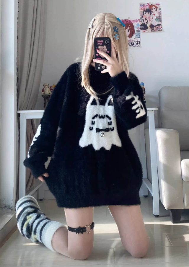 Fishbone embroidery detail on sleeves of black Jirai Kei ghost cat sweater showing craftsmanship and gothic aesthetic elements