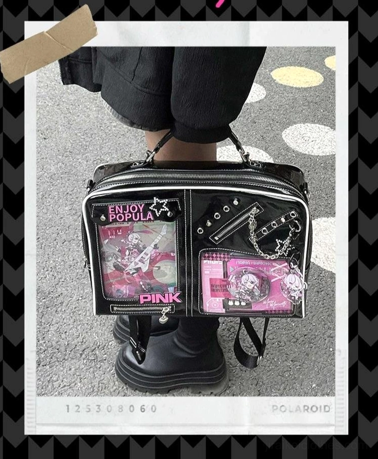 Black Jirai Kei ita handbag featuring anime character windows and punk chain accents outdoor display