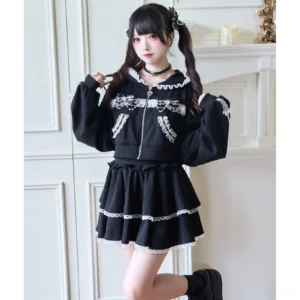 Black Jirai Kei lace-trimmed hoodie and tiered ruffle skirt set front view on model with twin-tails in vintage aesthetic setting