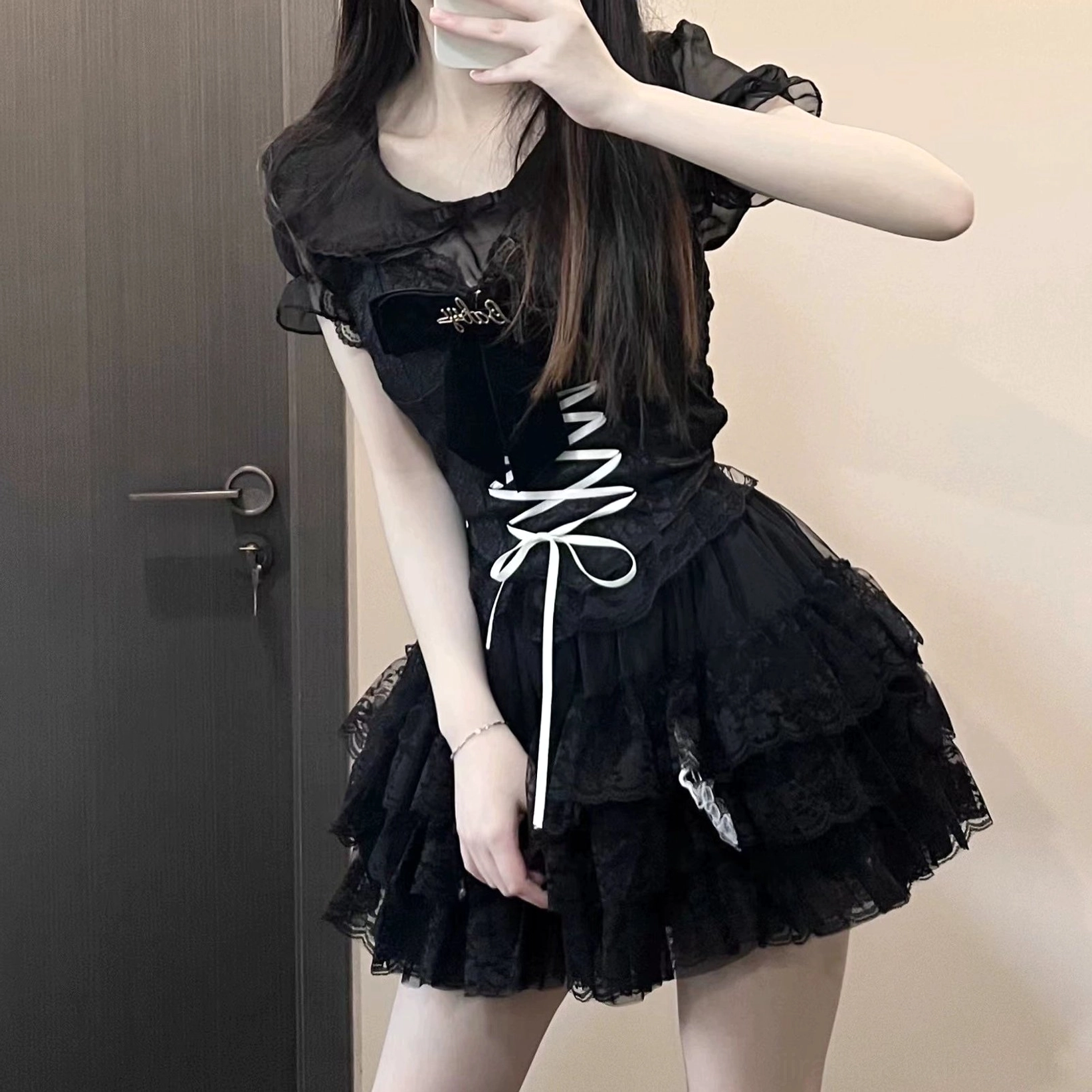 Jirai Kei black lace outfit set side profile mirror selfie showing sheer lace sleeves and white corset front lacing detail