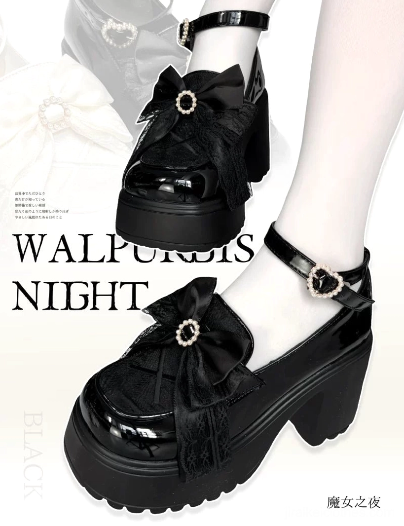 Black patent leather Jirai Kei platform loafer close-up of stockinged feet detail showing lace bow decoration and adjustable ankle strap studio background