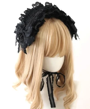 Black Jirai Kei lolita hair accessory headband with layered ruffled lace and fabric bows on blonde mannequin front three-quarter view