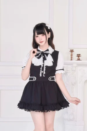 Black Jirai Kei maid dress with detachable bow tie full-body front view model platform shoes indoor setting