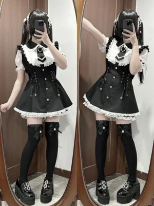 Black Jirai Kei maid dress set with white lace ruffled hem, corset waist detail, peter pan collar, and flutter sleeves worn with twin tails in home fitting room mirror selfie