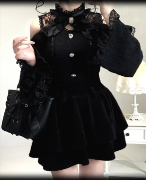 Pure Black Jirai Kei off-shoulder lace sweater with heart-shaped metal buttons and ruffled lace neck trim, front close-up detail shot on model