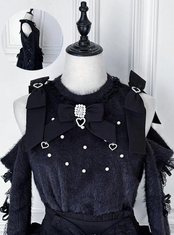 Black off-shoulder fuzzy sweater flat mannequin display with large removable bow collar, cross and heart pearl decorations, and lace ruffle trim showcasing Jirai Kei sweater style