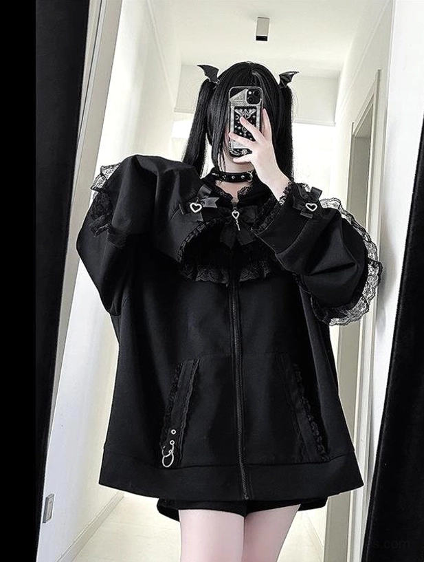Black oversized Jirai Kei zip-up hoodie featuring heart-shaped collar and detailed lace trims with functional zipper pockets, half-body front mirror selfie with devil tail accessories