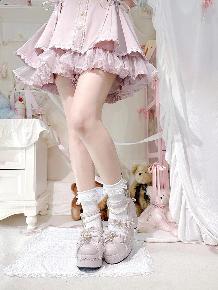 Black Jirai Kei platform Lolita shoes worn with ruffled skirt lace tights low angle aesthetic shot