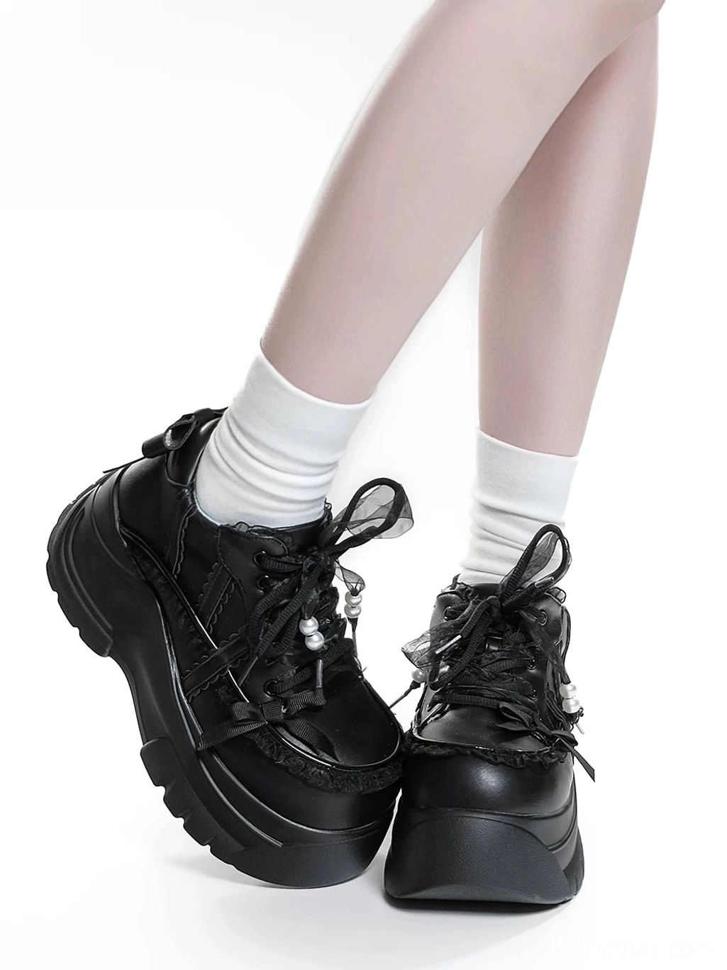 Black Jirai Kei platform shoes detailed angle view highlighting chunky thick sole textured platform and lace pearl shoelace ornaments
