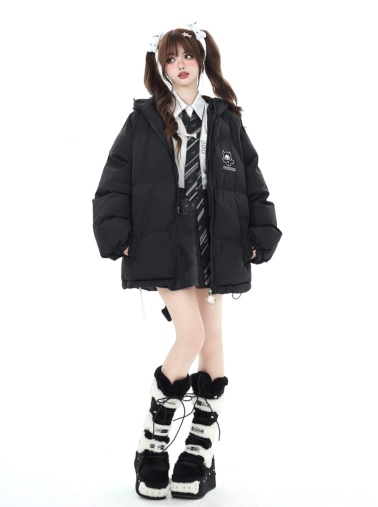 Black puffy Jirai Kei cotton coat left side full body view with quilted seams chest logo and loose sleeves on school uniform model