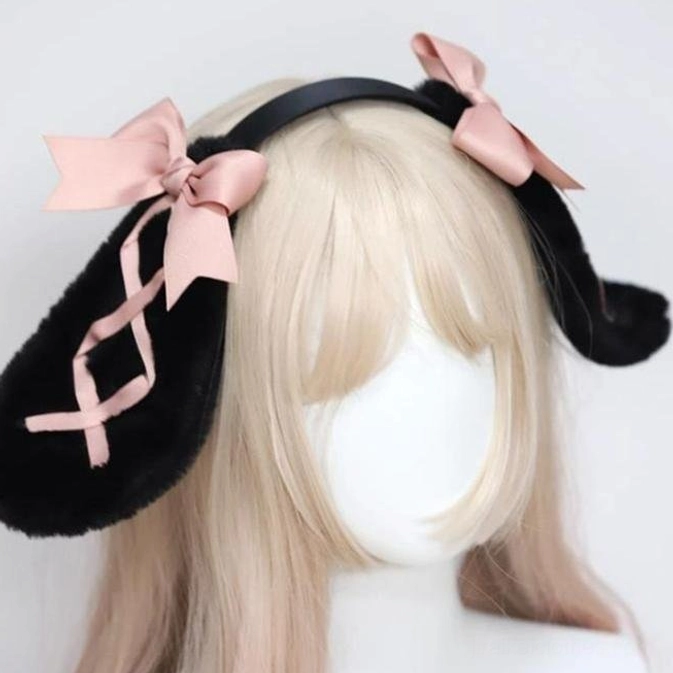 Black rabbit ear hairband three-quarter front view on mannequin wig display with fluffy black ears pink ribbon and pink satin bows